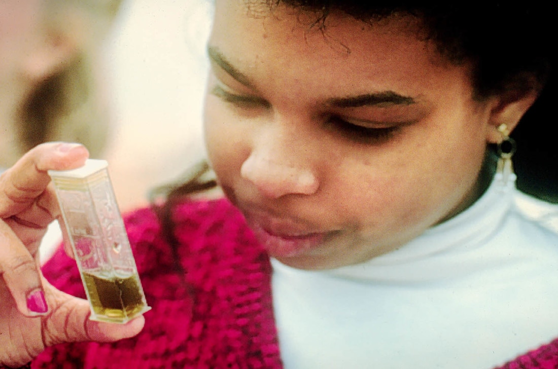 Photo of girl examining water sample